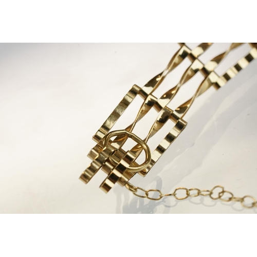 335 - 9ct yellow gold gate link bracelet, padlock clasp and safety chain, width approx 8.5mm