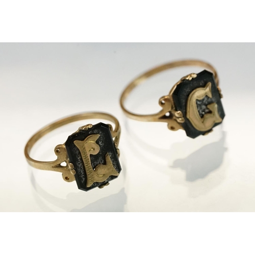 337 - Eleven letter head onyx rings stamped 9ct (11)