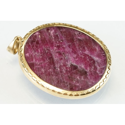 339 - Ruby 9ct yellow gold cameo pendant, the carved ruby depicting Jesus, rubover setting, length approx ... 