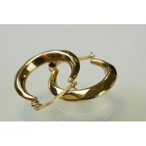 340 - Glass 9ct yellow gold dress ring, size K; together with a pair of 9ct yellow gold hoop earrings, ome... 