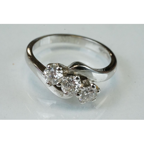 341 - Diamond 18ct white gold three stone crossover ring, three round brilliant cut diamonds, total stated... 