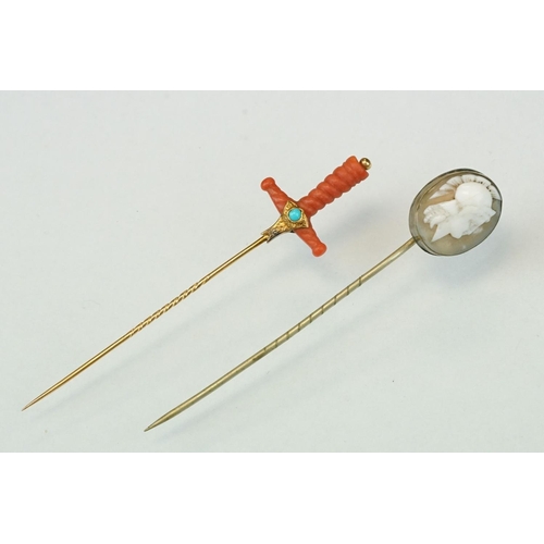 348 - Late 19th century coral, turquoise and split pearl unmarked gold stick pin modelled as a sword hilt,... 