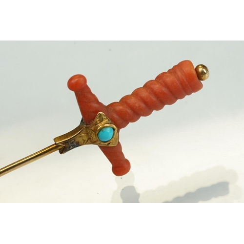 348 - Late 19th century coral, turquoise and split pearl unmarked gold stick pin modelled as a sword hilt,... 