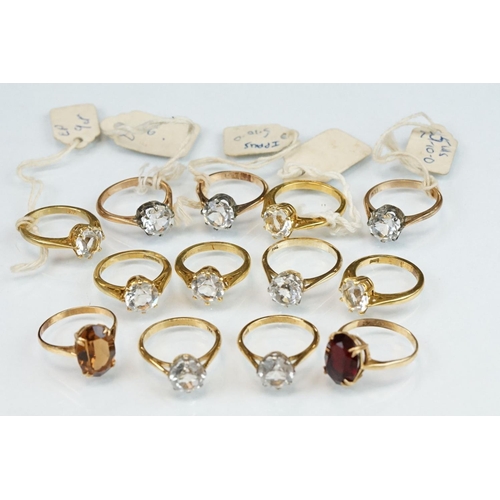 354 - Two paste set rings stamped 9ct together with eleven paste set yellow metal rings (13)