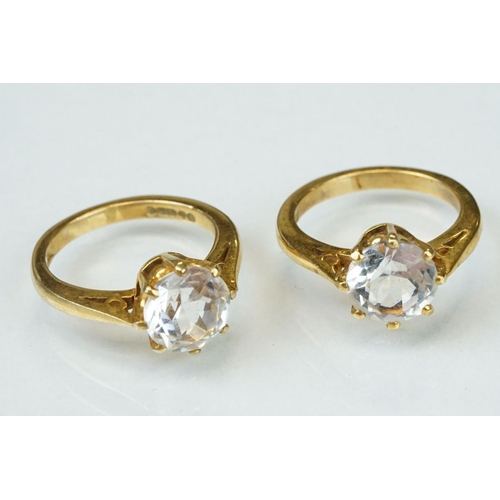 354 - Two paste set rings stamped 9ct together with eleven paste set yellow metal rings (13)