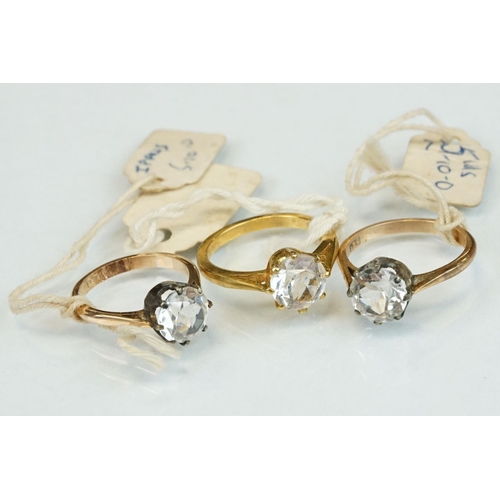 354 - Two paste set rings stamped 9ct together with eleven paste set yellow metal rings (13)