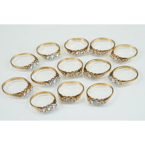 355 - Thirteen paste set dress rings stamped 9ct (13)