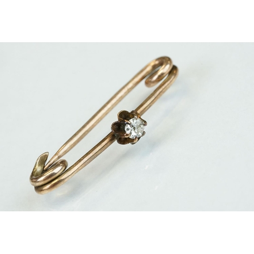 356 - Late Victorian diamond 9ct rose gold bar brooch, small round old cut diamond, coronet claw set, leng... 