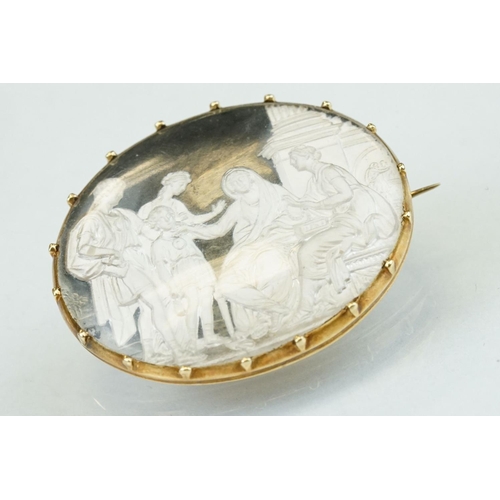 360 - Victorian cameo style yellow metal brooch, the scene depicting a family coming to see two women, cla... 