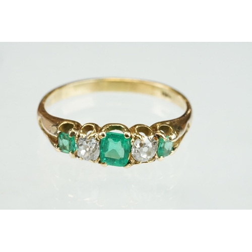 42 - 19th century emerald and diamond unmarked yellow gold ring, possibly stamped 18ct, three graduated e... 