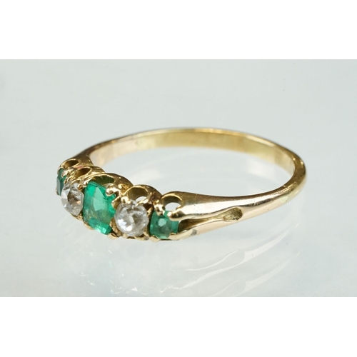 42 - 19th century emerald and diamond unmarked yellow gold ring, possibly stamped 18ct, three graduated e... 