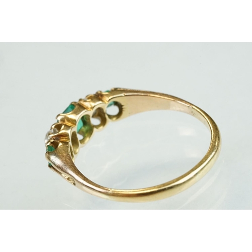 42 - 19th century emerald and diamond unmarked yellow gold ring, possibly stamped 18ct, three graduated e... 