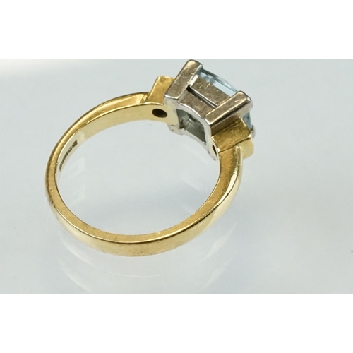 45 - Aquamarine diamond 18ct yellow gold ring, the rectangular mixed cut aquamarine measuring approx 7.5m... 