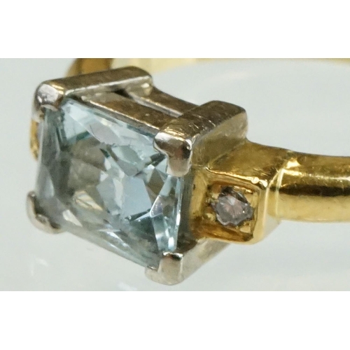 45 - Aquamarine diamond 18ct yellow gold ring, the rectangular mixed cut aquamarine measuring approx 7.5m... 