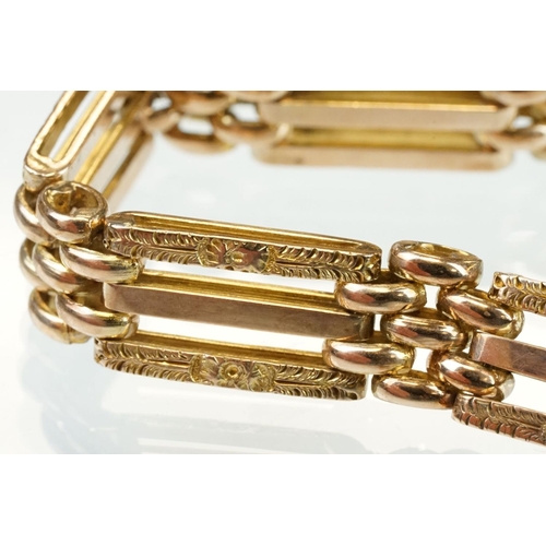 47 - 9ct yellow gold gate link bracelet, heart shaped padlock clasp with foliate scroll decoration, the l... 