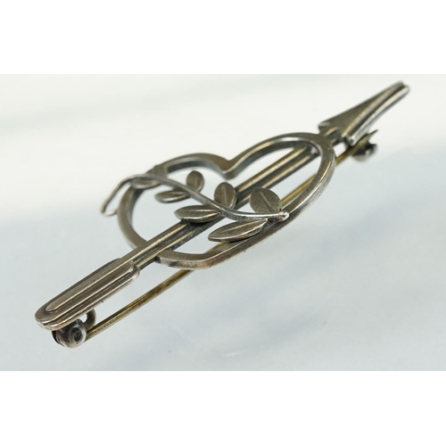 50 - Arno Malinowski for Georg Jensen silver brooch modelled as an arrow and heart with scrolling leaves;... 