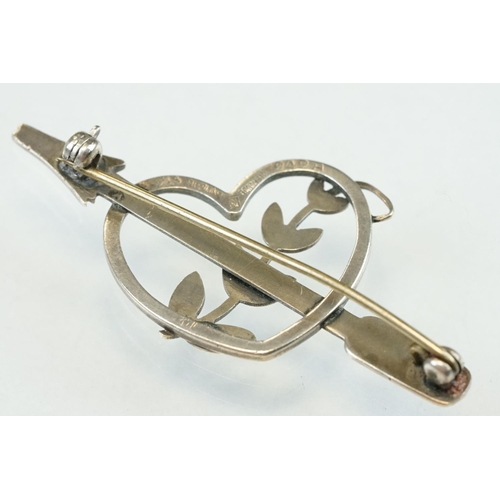 50 - Arno Malinowski for Georg Jensen silver brooch modelled as an arrow and heart with scrolling leaves;... 