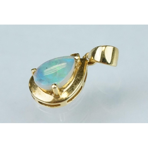 123 - Opal 18ct yellow gold pendant, pear shaped cabochon cut precious white opal displaying blue and gree... 