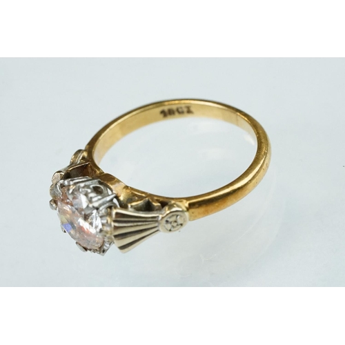 129 - Diamond solitaire 18ct yellow and white gold set ring, the round brilliant cut diamond weighing appr... 