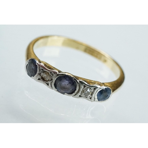 130 - Sapphire and diamond 18ct yellow gold and platinum set five stone ring, three round mixed cut sapphi... 