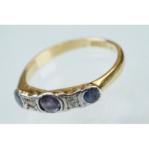 130 - Sapphire and diamond 18ct yellow gold and platinum set five stone ring, three round mixed cut sapphi... 