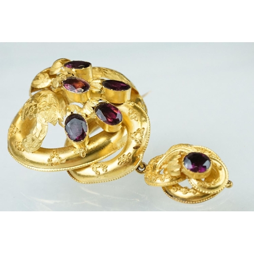 136 - Victorian garnet yellow metal brooch, six oval mixed cut purple garnets, rubover settings, floral, f... 