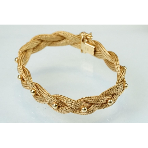 137 - 18ct yellow gold bracelet, plaited form with bead decoration, tongue and box clasp with safety catch... 