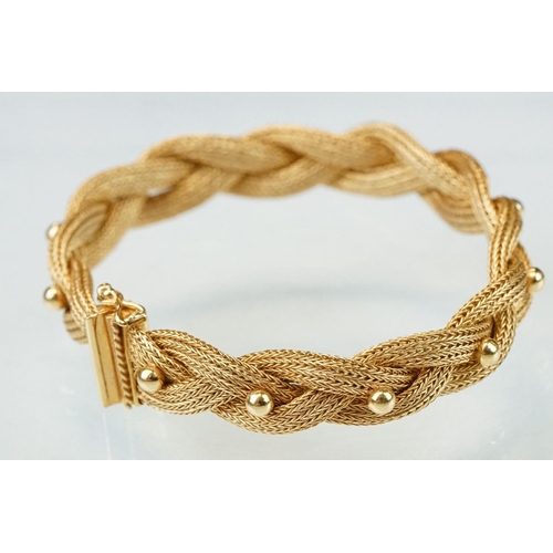 137 - 18ct yellow gold bracelet, plaited form with bead decoration, tongue and box clasp with safety catch... 