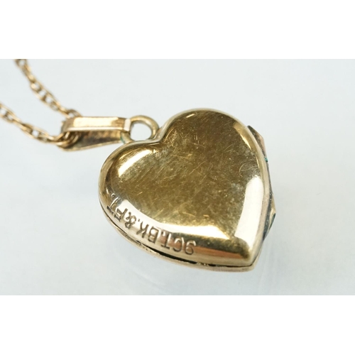 149 - Edwardian 9ct yellow gold heart shaped locket pendant necklace, engraved floral and foliate decorati... 