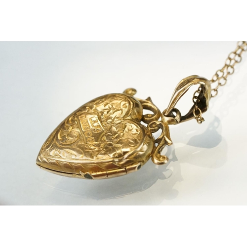 149 - Edwardian 9ct yellow gold heart shaped locket pendant necklace, engraved floral and foliate decorati... 