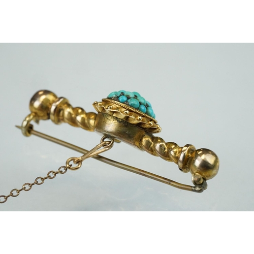 153 - 19th century turquoise yellow metal bar brooch, the central oval panel set with nineteen graduated s... 