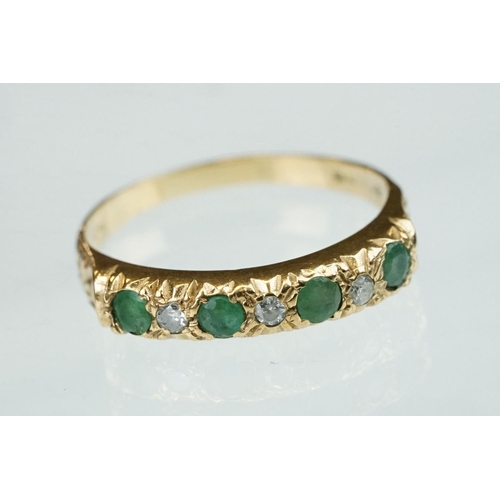 157 - Emerald and diamond 9ct yellow gold ring, four small round mixed cut emeralds, three small round bri... 