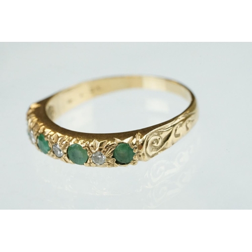 157 - Emerald and diamond 9ct yellow gold ring, four small round mixed cut emeralds, three small round bri... 