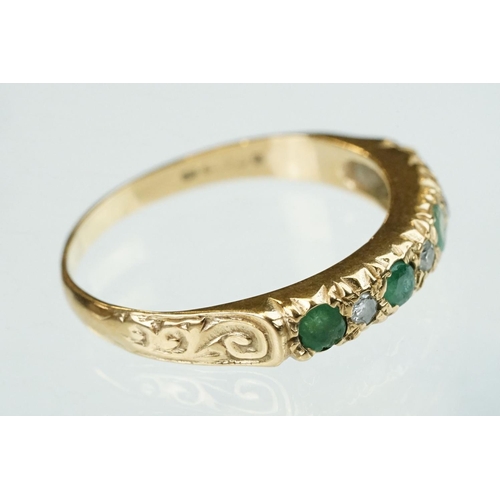 157 - Emerald and diamond 9ct yellow gold ring, four small round mixed cut emeralds, three small round bri... 