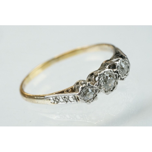 160 - Diamond three stone unmarked yellow gold platinum set ring, three graduated round brilliant cut diam... 