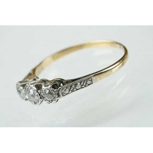 160 - Diamond three stone unmarked yellow gold platinum set ring, three graduated round brilliant cut diam... 