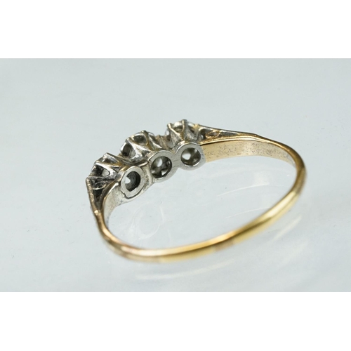 160 - Diamond three stone unmarked yellow gold platinum set ring, three graduated round brilliant cut diam... 