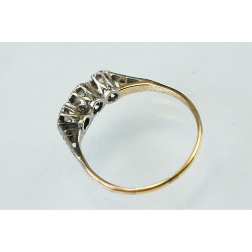 160 - Diamond three stone unmarked yellow gold platinum set ring, three graduated round brilliant cut diam... 