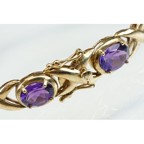 181 - Amethyst 9ct yellow gold bracelet, ten oval mixed cut amethysts, measuring 8mm x 6mm, four claw sett... 