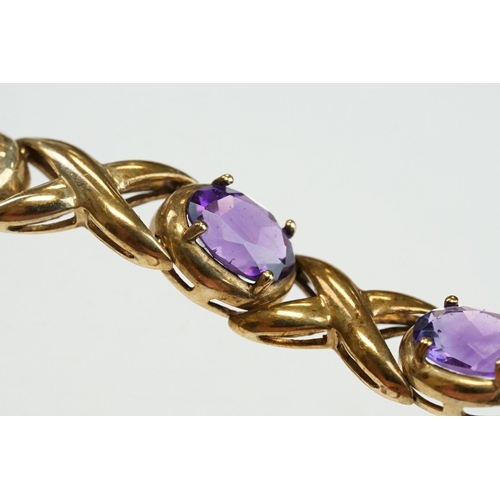 181 - Amethyst 9ct yellow gold bracelet, ten oval mixed cut amethysts, measuring 8mm x 6mm, four claw sett... 