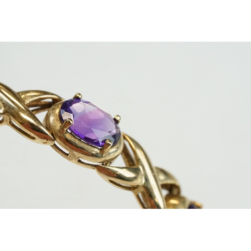 181 - Amethyst 9ct yellow gold bracelet, ten oval mixed cut amethysts, measuring 8mm x 6mm, four claw sett... 