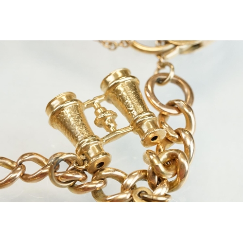 182 - 9ct yellow gold charm bracelet with padlock clasp, seven charms, the links unmarked