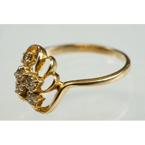 192 - Diamond yellow metal ring, four small round brilliant cut diamonds, total diamond weight approx 0.20... 