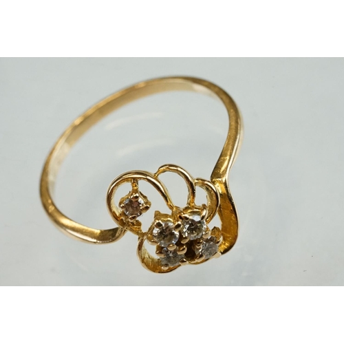 192 - Diamond yellow metal ring, four small round brilliant cut diamonds, total diamond weight approx 0.20... 