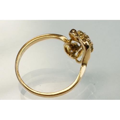 192 - Diamond yellow metal ring, four small round brilliant cut diamonds, total diamond weight approx 0.20... 