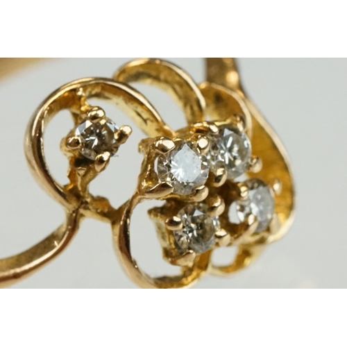 192 - Diamond yellow metal ring, four small round brilliant cut diamonds, total diamond weight approx 0.20... 