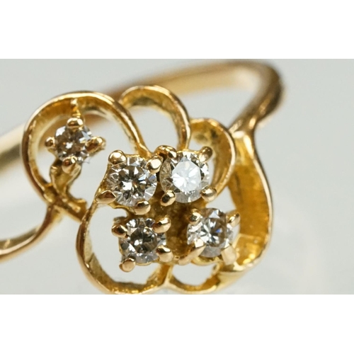 192 - Diamond yellow metal ring, four small round brilliant cut diamonds, total diamond weight approx 0.20... 