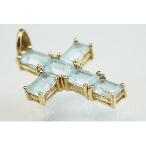 198 - Topaz 9ct yellow gold cross pendant, six rectangular mixed cut blue topaz, claw set, length approx 2... 