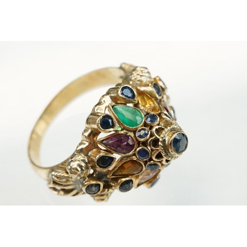 199 - Indian multigem set 18ct yellow gold ring, the head of conical ogee form set with sapphire, emerald,... 