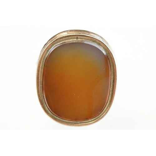 201 - Agate 9ct rose and yellow gold ring, the oval agate panel measuring approx 23mm x 18mm, rubover set,... 